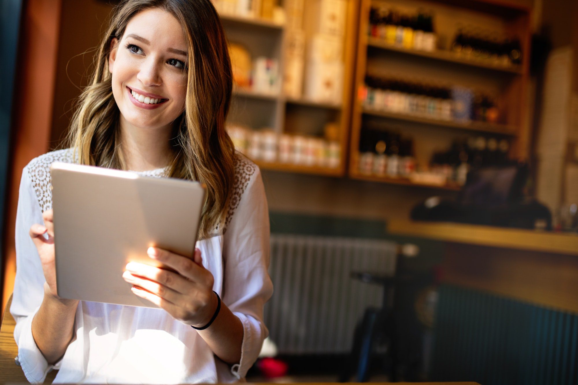 Beautiful brunette girl using laptop for work, freelance, blogging, studying, shopping