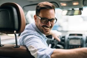 Portrait of a businessman driving car