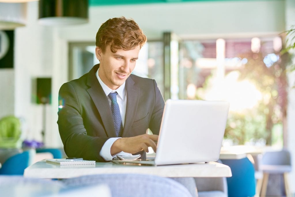 Elegant Businessman Working with Laptop