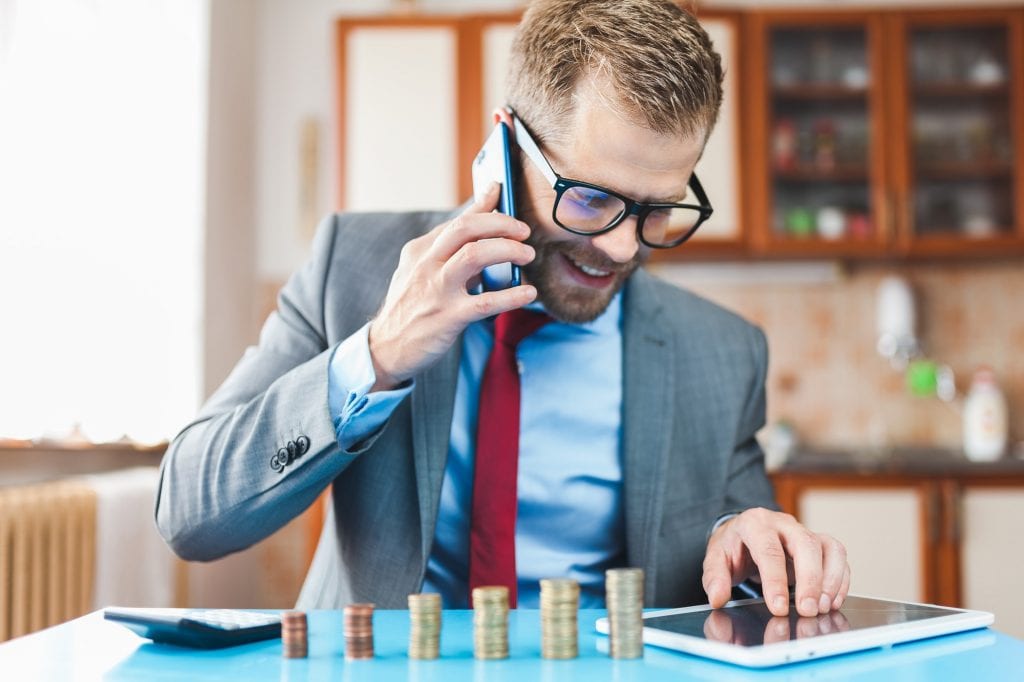 Working from home. Businessman checking on returns from his investment