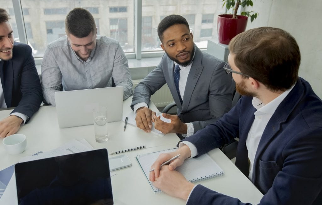 Young multiracial business team working process in office